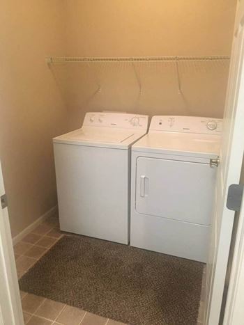 a white washer and dryer in a room at Courtyard Apartments, Moorhead, MN, 56560
